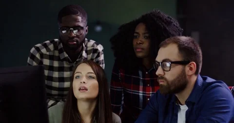 Young friendly multi-ethnic office workers creating a strategy for a startup Stock Footage 82447603
