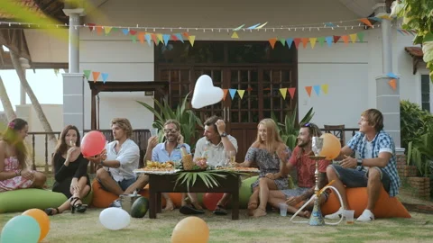 Young friends celebrating festive party Stock Footage 93409953