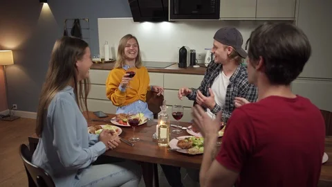 Young friends chatting at dinner Stock Footage 114809136