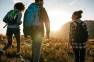 Young Friends On Countryside Hiking Stock Photos
