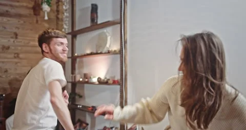 Young friends dancing during party together. Young female hippie in light Stockbeeldmateriaal 172553937