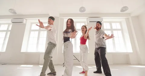 Young Friends Dancing Together During Energetic Hip Hop Studio Rehearsal Stock Footage 345424399