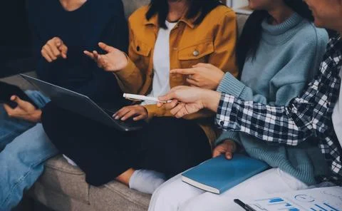 Young friends doing school assignment together at home Stock Photos