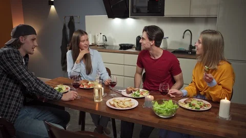 Young friends having fun at dinner Stock Footage 114808710