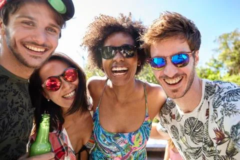Young friends having fun at poolside Stock Photos