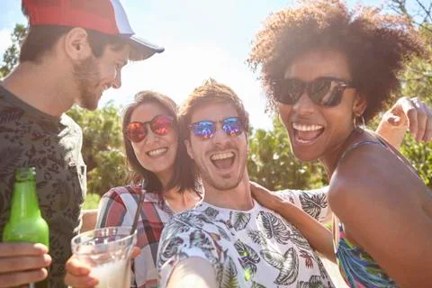 Young friends having fun at poolside Stock Photos