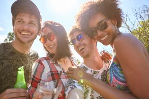Young friends having fun at poolside Stock Photos