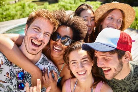 Young friends having fun at poolside Stock Photos