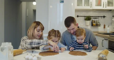 Young full family having fun baking cookies in the kitchen together Stock Footage 146113997