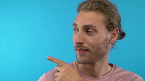 Young fun guy 20s 30s years old in pink t-shirt isolated on blue background Stock Footage 137457759
