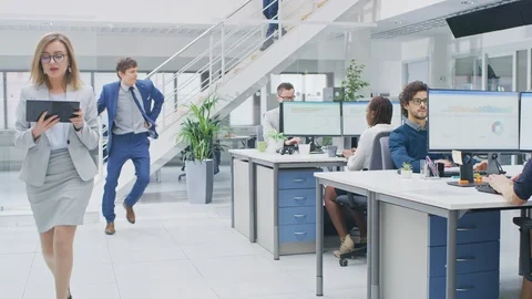 Young Fun Loving and Handsome Businessman Dances Through the Open Space Office Stock Footage 106765749