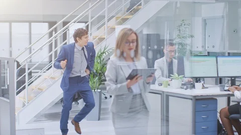 Young Fun Loving and Handsome Businessman Dances Through the Open Space Office Stock Footage 106775459
