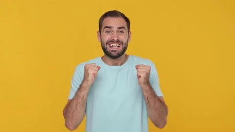 Young fun man 20s in basic casual blue t-shirt isolated on yellow background Stock Footage 148287262