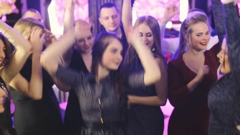 Young fun party people dancing at the night club Stock Footage 74956646