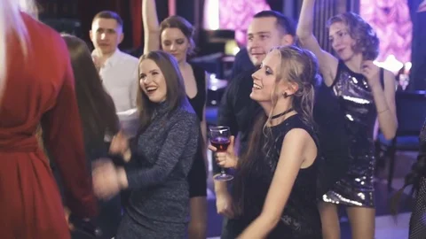 Young fun party people dancing at the night club Stock Footage 75037365