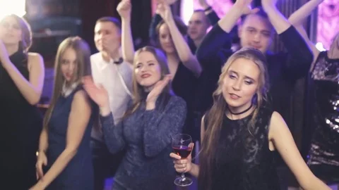 Young fun party people dancing at the night club Stock Footage 75037507