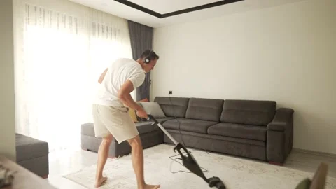 Young Funny Man Dancing With Vacuum Cleaner Playing Guitar. 스톡 동영상 195785908