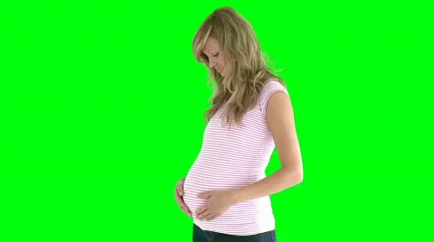 Young future mom standing against green screen Vídeos de archivo 845667