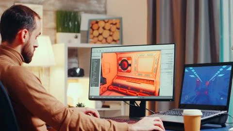 Young game developer using modern software Stock Photos