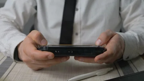 The young game player's hands control the joystick playing on the screen Stock-Footage 334653443