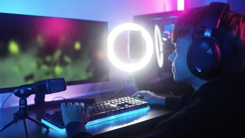 Young gamer streaming while playing video game online. E-sports competition  Stock Footage 260908006