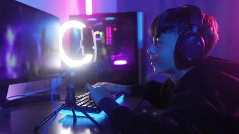Young gamer streaming while playing video game online. E-sports competition  Stock Footage 275304712