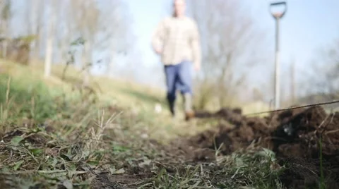 Young Gardener going back home from the garden in slow motion Stock Footage 44228221