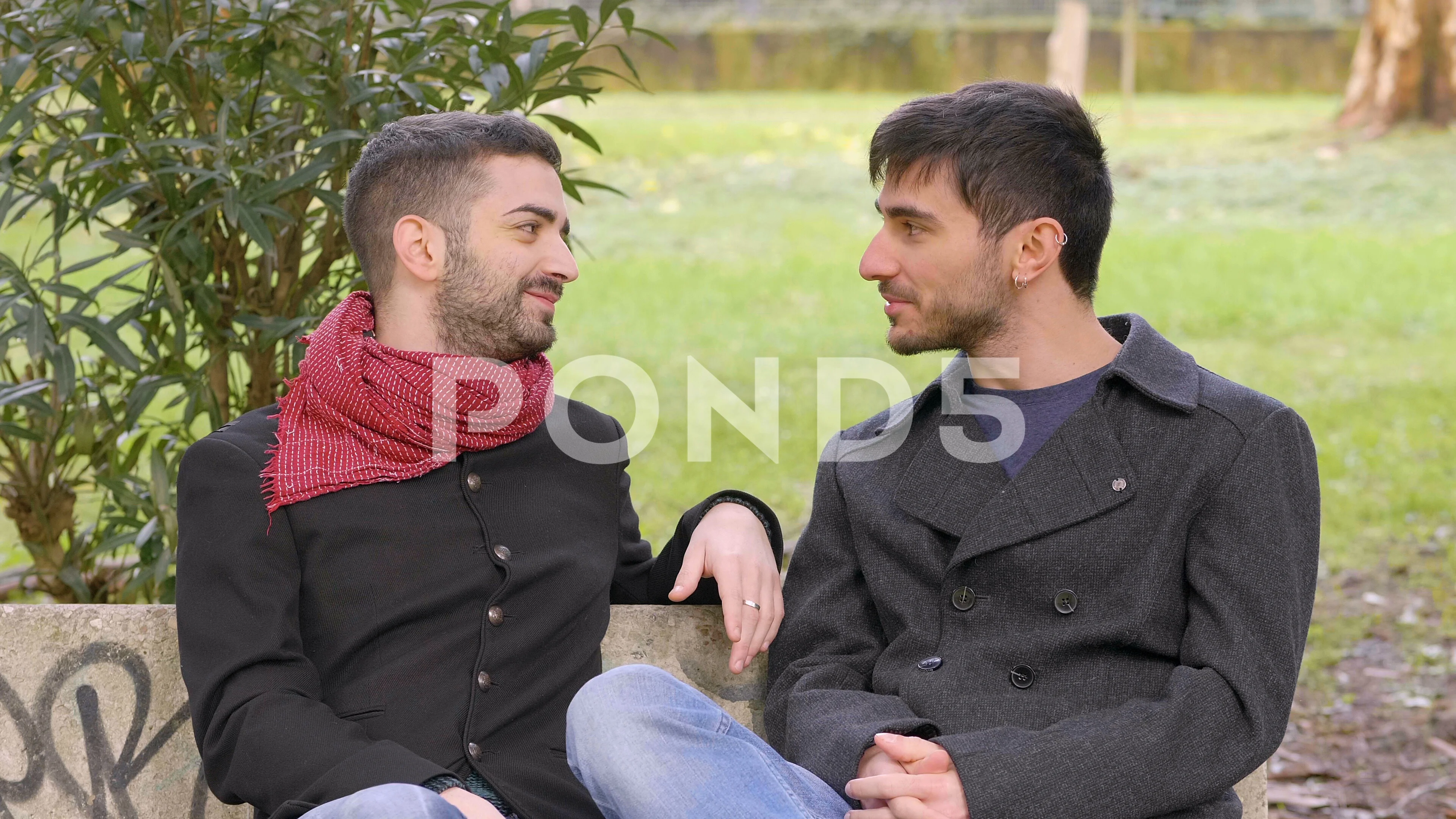 young gay on a bench at the park refusin... | Stock Video | Pond5
