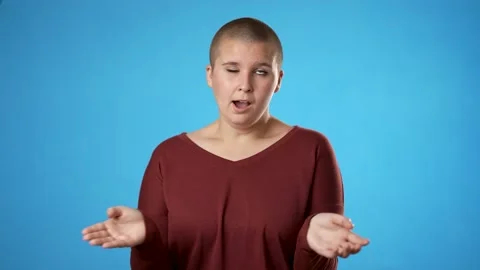 Young gender fluid non binary woman 20s look at camera claps without enthusiasm Stock Footage 221252673