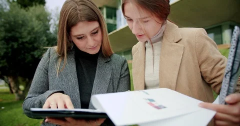 Young generation business team concept, pensive Caucasian females with paper Stock Footage 120748009