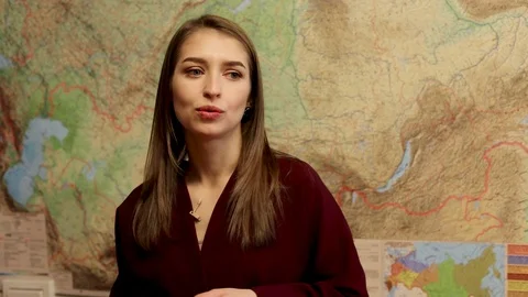 Young geography teacher explaining lesson Stock Footage 121942332