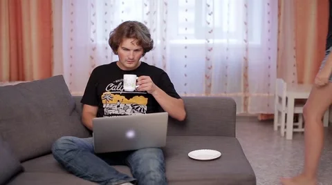 A young girl and a young guy looking at laptop Stock Footage