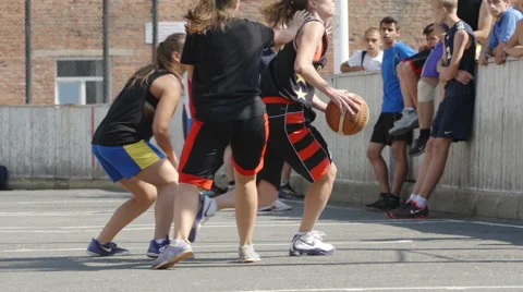 Young girl attacks and throws a ball into a basket in a streetbal (slow motion) Видео 68155473