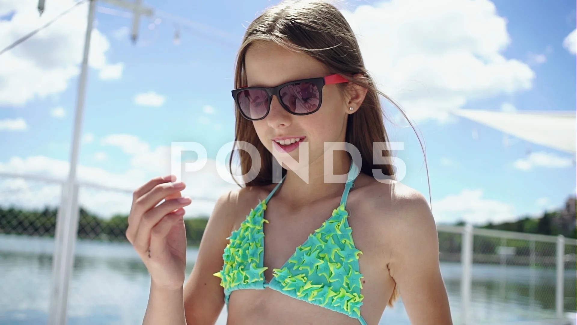 Young girl in bikini moving her hair, Stock Video