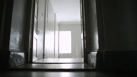 Young girl in blue dress with documents descends the stairs 動画素材 73490153