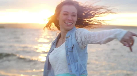  Young girl with braces and developing hair fun dancing on the beach Stock Footage 60844171