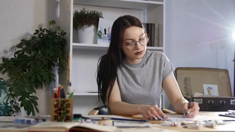 Young girl breaks and throws paper Stock Footage