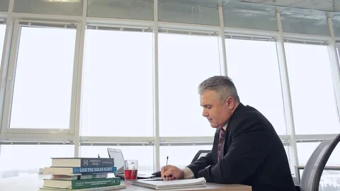 A young girl brings the documents to his boss. Cute smiling at each other. The Stock Footage 71069451