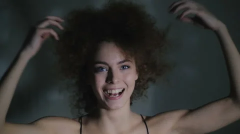 The young girl broadly smiles and has fun Stock Footage 59238584