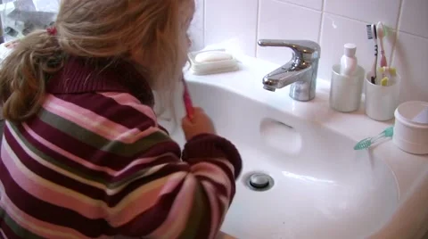 Young girl brushing teeth Stock Footage 47657301