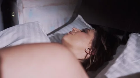 Young Girl Cannot Fall Asleep from Noise Stock Footage 133235618