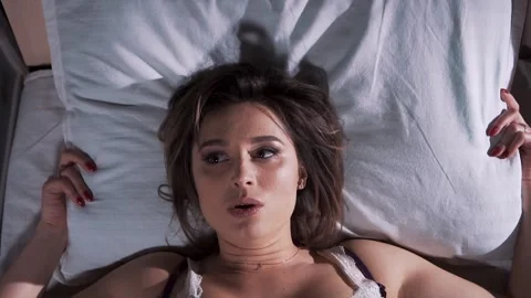 Young Girl Cannot Fall Asleep from Noise Stock Footage 133235779
