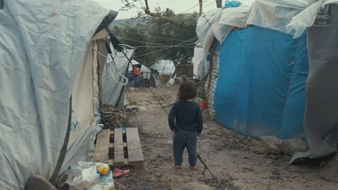 Young girl child in Moria Refugee Camp dire inhumane conditions Stock Footage