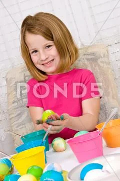 Young Girl Coloring Easter Eggs