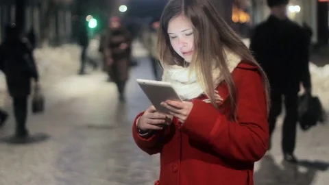 Young girl commuter using tablet at city Stock Footage 71583807
