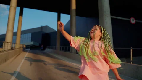 Young girl dancer dancing hip hop at car parking close up Stock Footage 202216634