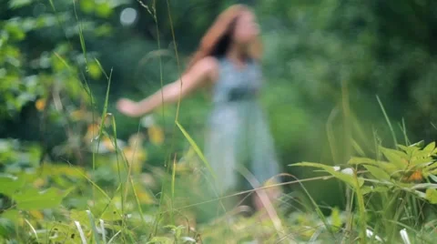 Young Girl Dances Outdoors. Focus in a Green Meadow 스톡 동영상 59346994