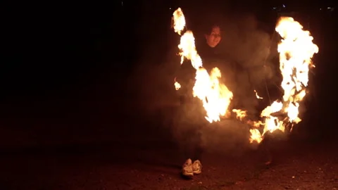 A young girl dancing with fire. Fire show, artist. The girl was burned by fire. Stock Footage 246206486