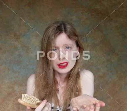 Young girl with desperation over loosing hair Stock Photos
