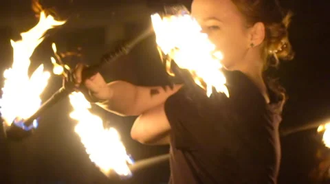Young girl does a fire performance Stock Footage 62880433